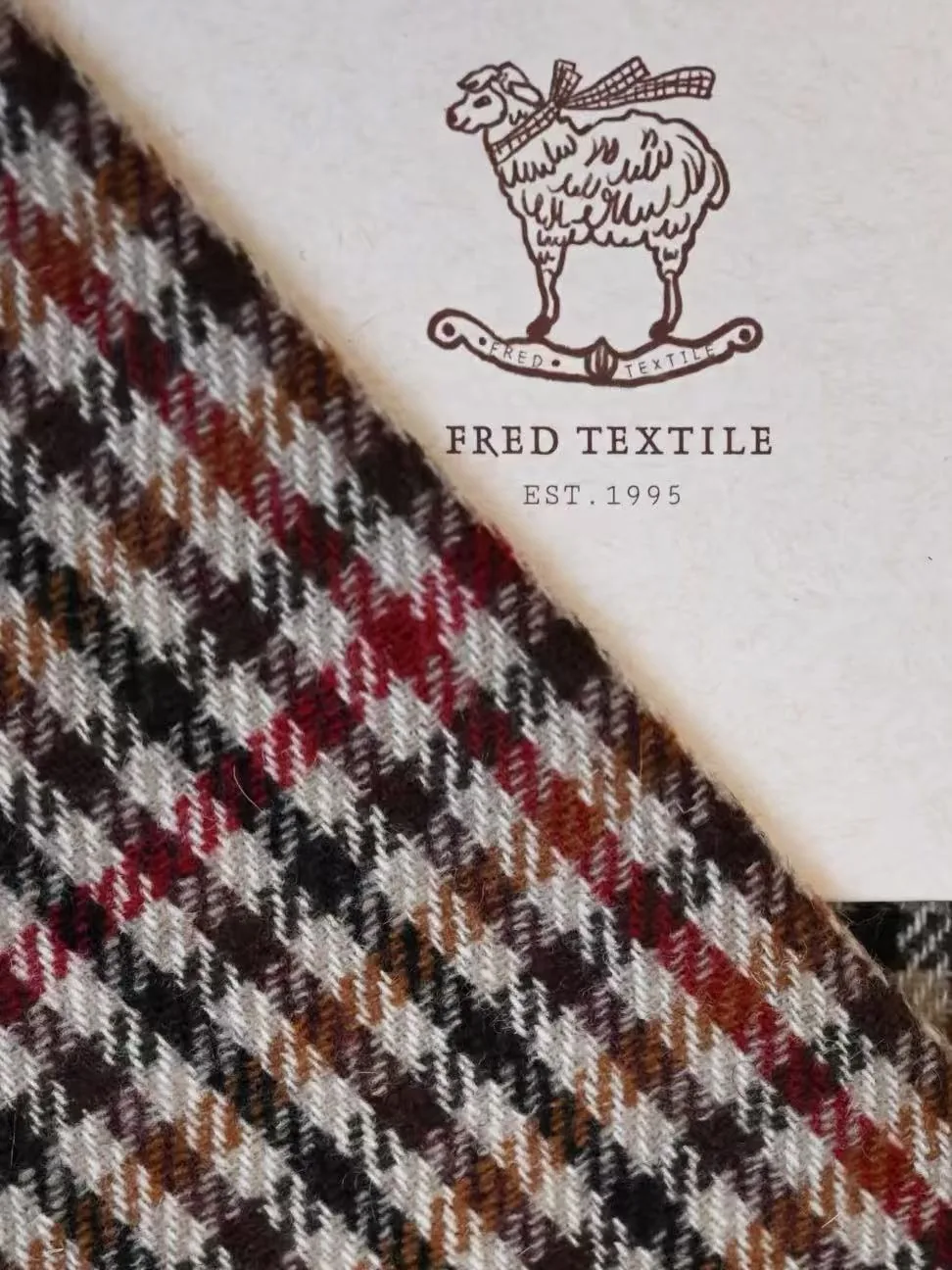 Fred Textile card with a multicolour woolen check fabric sample