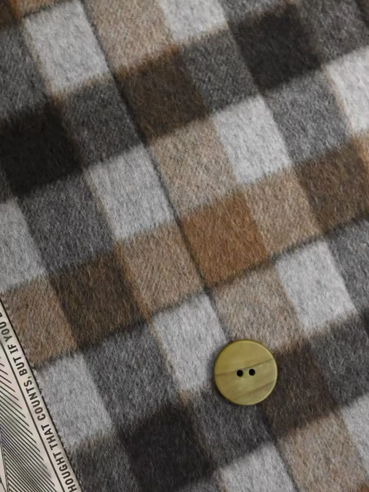Hairy woolen check fabric in grey camel and cream with a button